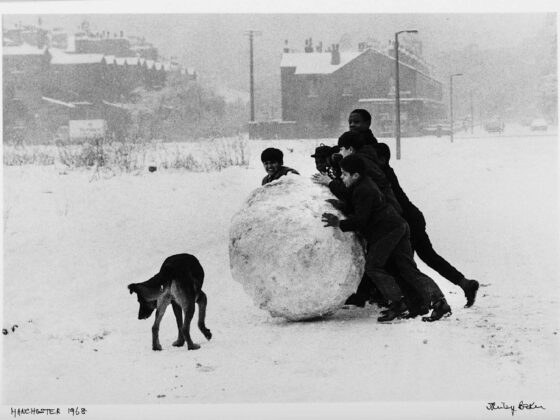 Shirley Baker, Children Pushing a Snowball, Manchester, 1968, 1968. Image courtesy of James Hyman Gallery