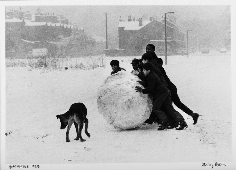 Shirley Baker, Children Pushing a Snowball, Manchester, 1968, 1968. Image courtesy of James Hyman Gallery